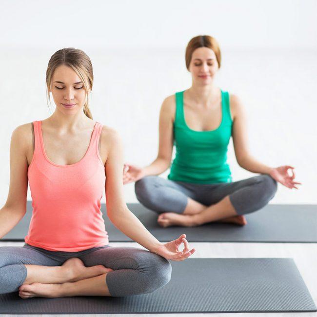 meditating before doing a yoga class